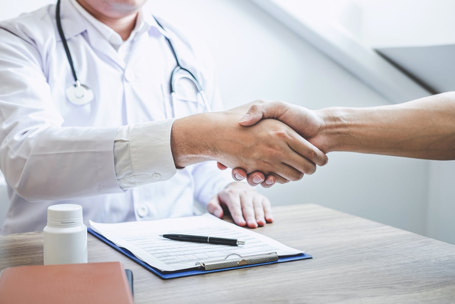 Doctor Shaking Hands to Congrats Patient